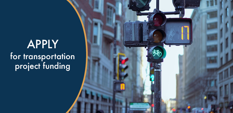 Image of a traffic light with bike sign. Text says "apply for transportation project funding"