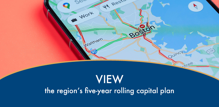 Close-up photograph of a smart phone showing traffic congestion on a map of the Boston area with text underneath reading "View the region's five-year rolling capital plan"